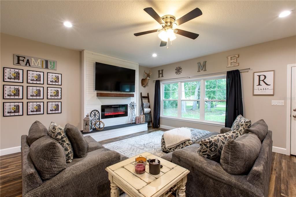 Fireplace, Interior, Living room, Recessed Lighting, Wood Texture Flooring