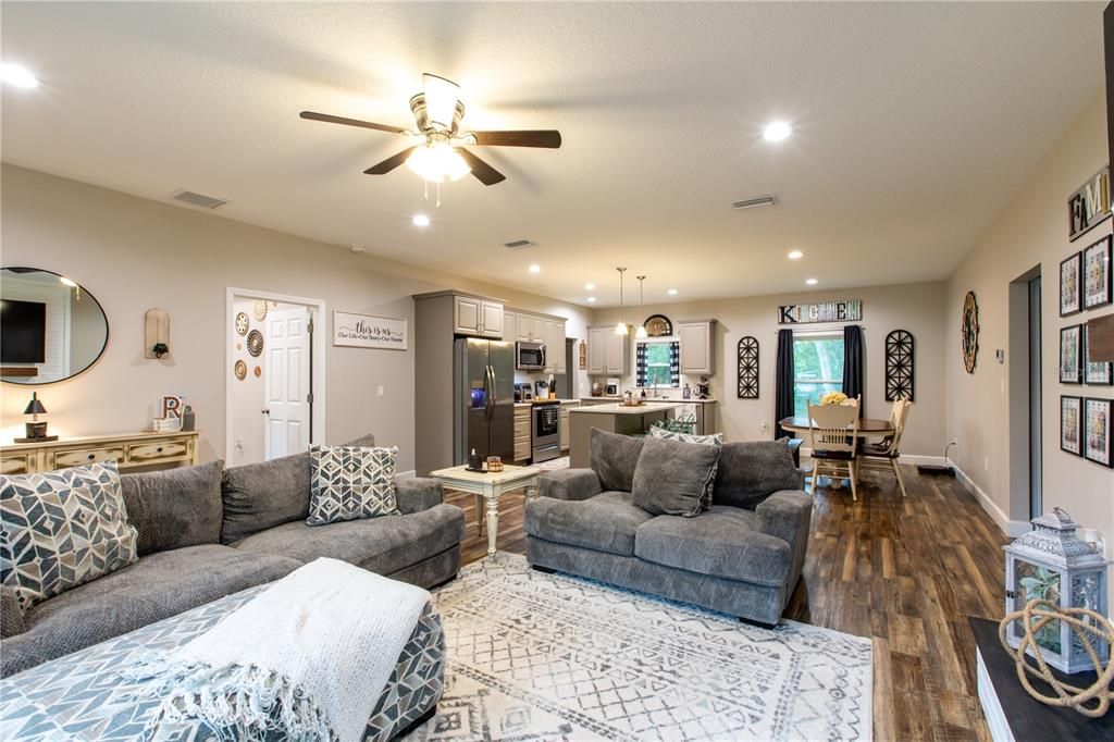 Dining room, Interior, Kitchen, Living room, Pendant Lights, Recessed Lighting, Stainless Steel Appliances, Wood Texture Flooring