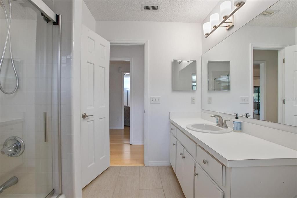 Bathroom, Dual Sink Vanities, Glass Shower, Interior, Wood Texture Flooring