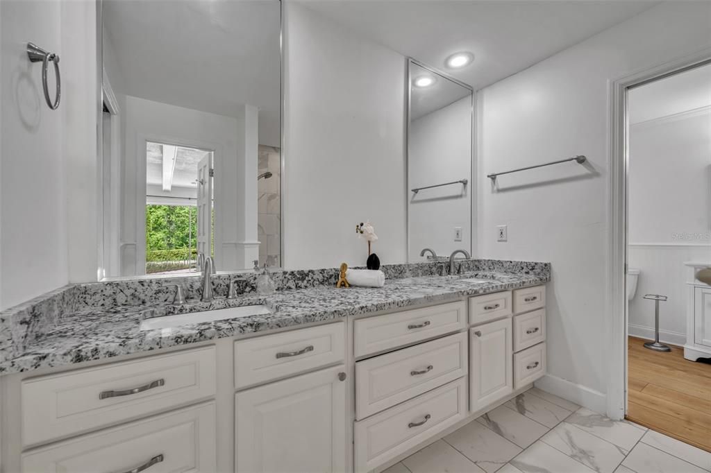 Bathroom, Dual Sink Vanities, Interior, Marble, Recessed Lighting, Wood Texture Flooring
