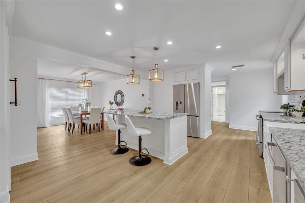Dining room, Interior, Kitchen, Pendant Lights, Recessed Lighting, Stainless Steel Appliances, Wood Texture Flooring