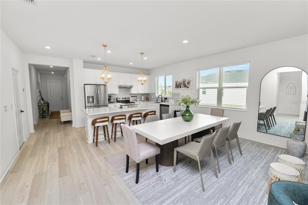 Chandelier, Dining room, Interior, Kitchen, Pendant Lights, Recessed Lighting, Stainless Steel Appliances, Wood Texture Flooring