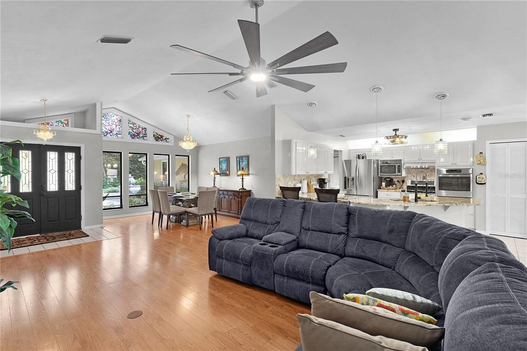 Chandelier, Dining room, Interior, Kitchen, Living room, Pendant Lights, Stainless Steel Appliances, Wood Texture Flooring