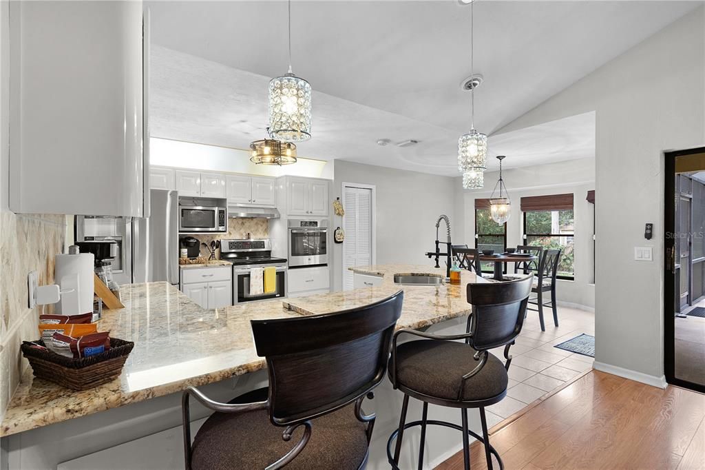 Dining room, Interior, Kitchen, Pendant Lights, Stainless Steel Appliances, Wood Texture Flooring