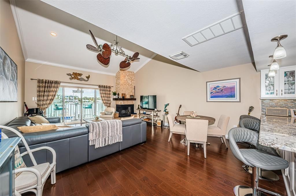 Dining room, Fireplace, Interior, Living room, Recessed Lighting, Wood Texture Flooring