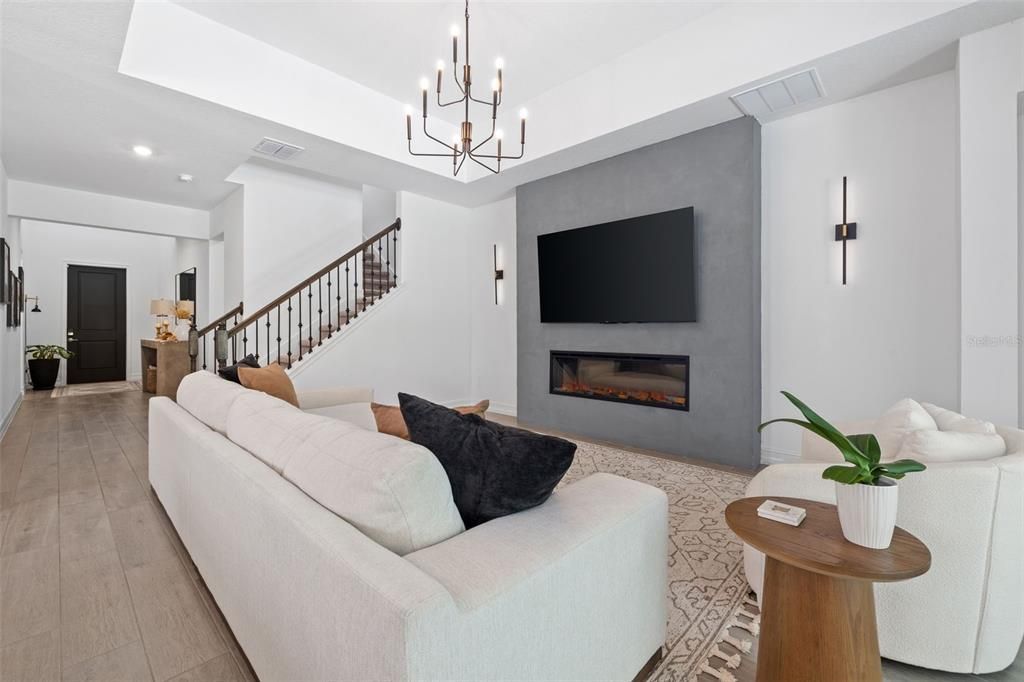 Chandelier, Fireplace, Interior, Living room, Recessed Lighting, Wood Texture Flooring