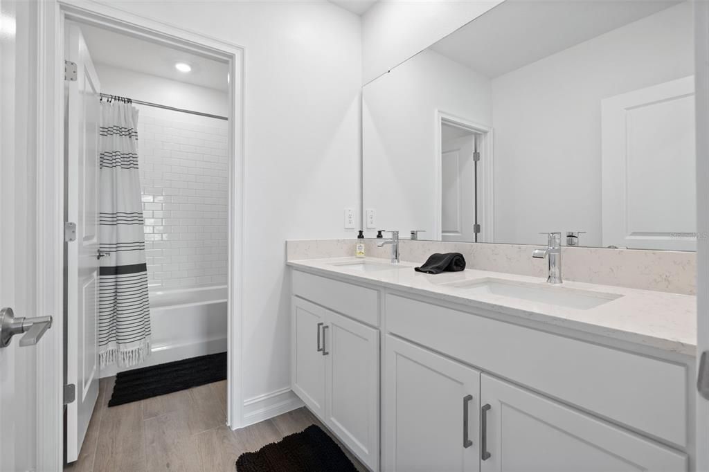 Bathroom, Dual Sink Vanities, Interior, Recessed Lighting, Wood Texture Flooring