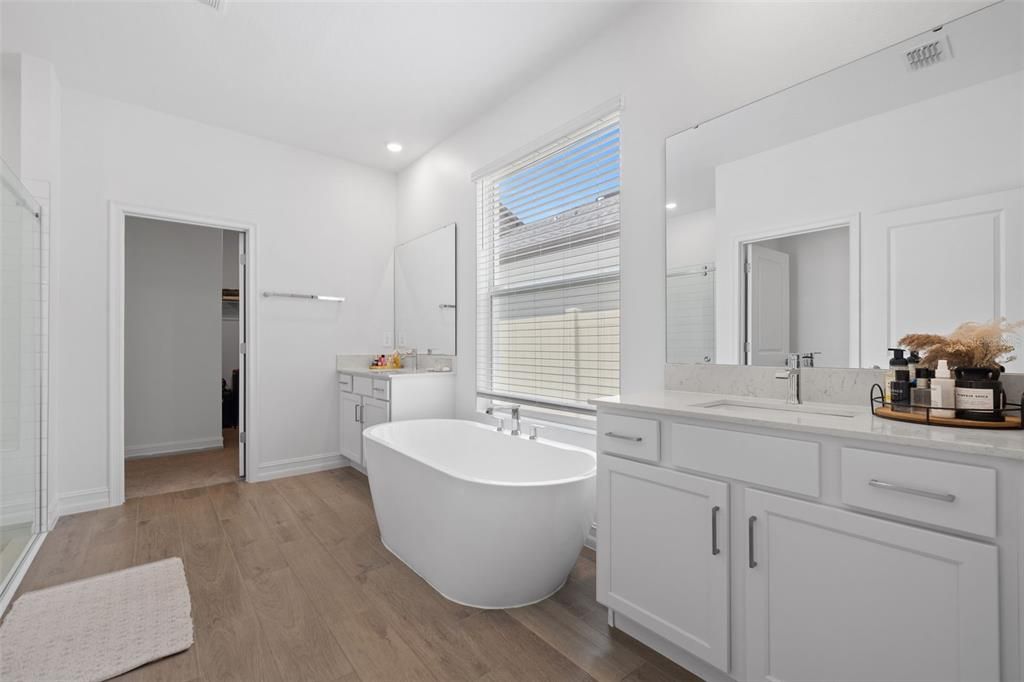 Bathroom, Dual Sink Vanities, Free Standing Baths, Interior, Recessed Lighting, Wood Texture Flooring