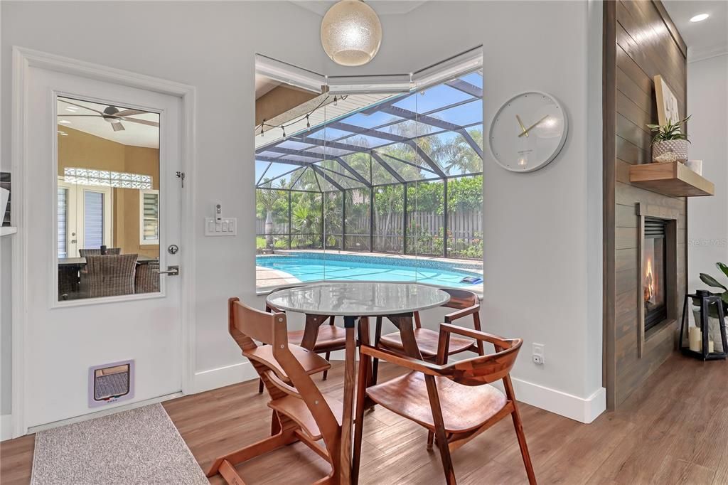 Dining room, Fireplace, Glass Ceilings, Interior, Pool, Recessed Lighting, Sun Room, Wood Texture Flooring