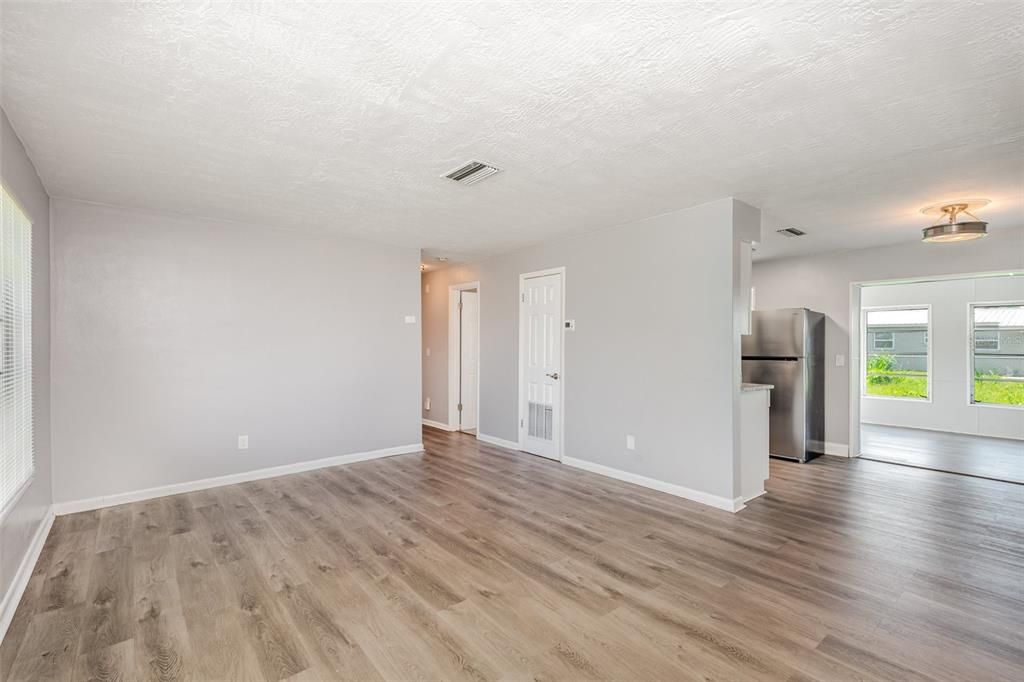 Empty room, Interior, Kitchen, Stainless Steel Appliances, Wood Texture Flooring