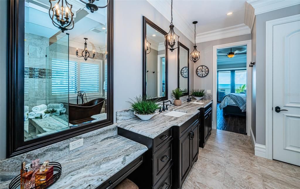 Bathroom, Chandelier, Dual Sink Vanities, Glass Shower, Interior, Pendant Lights, Recessed Lighting, Water, Wood Texture Flooring