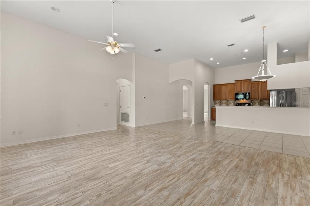 Empty room, Fireplace, Interior, Kitchen, Pendant Lights, Recessed Lighting, Wood Texture Flooring