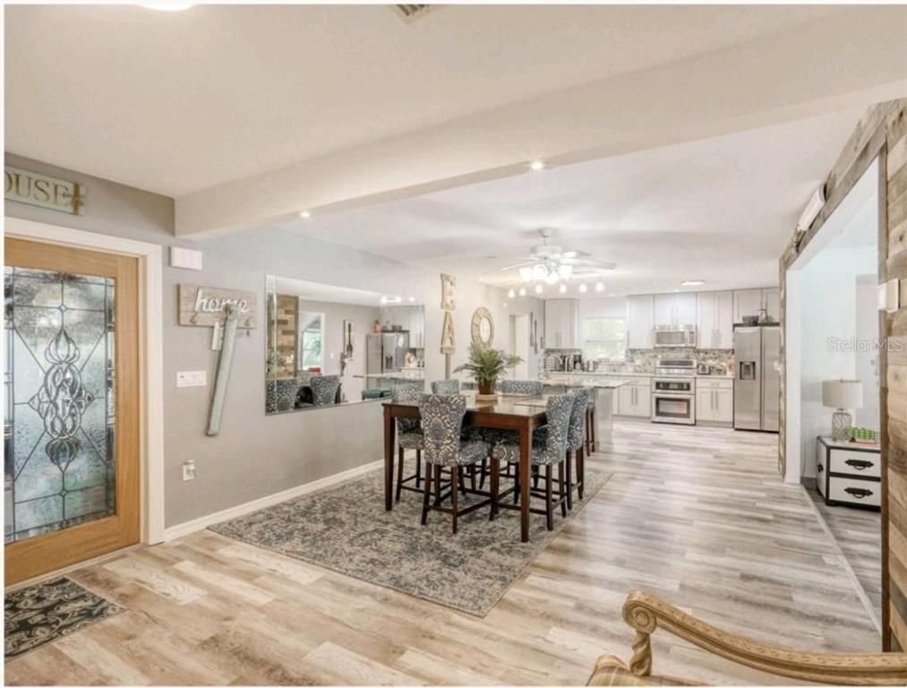 Dining room, Interior, Kitchen, Recessed Lighting, Stainless Steel Appliances, Wood Texture Flooring