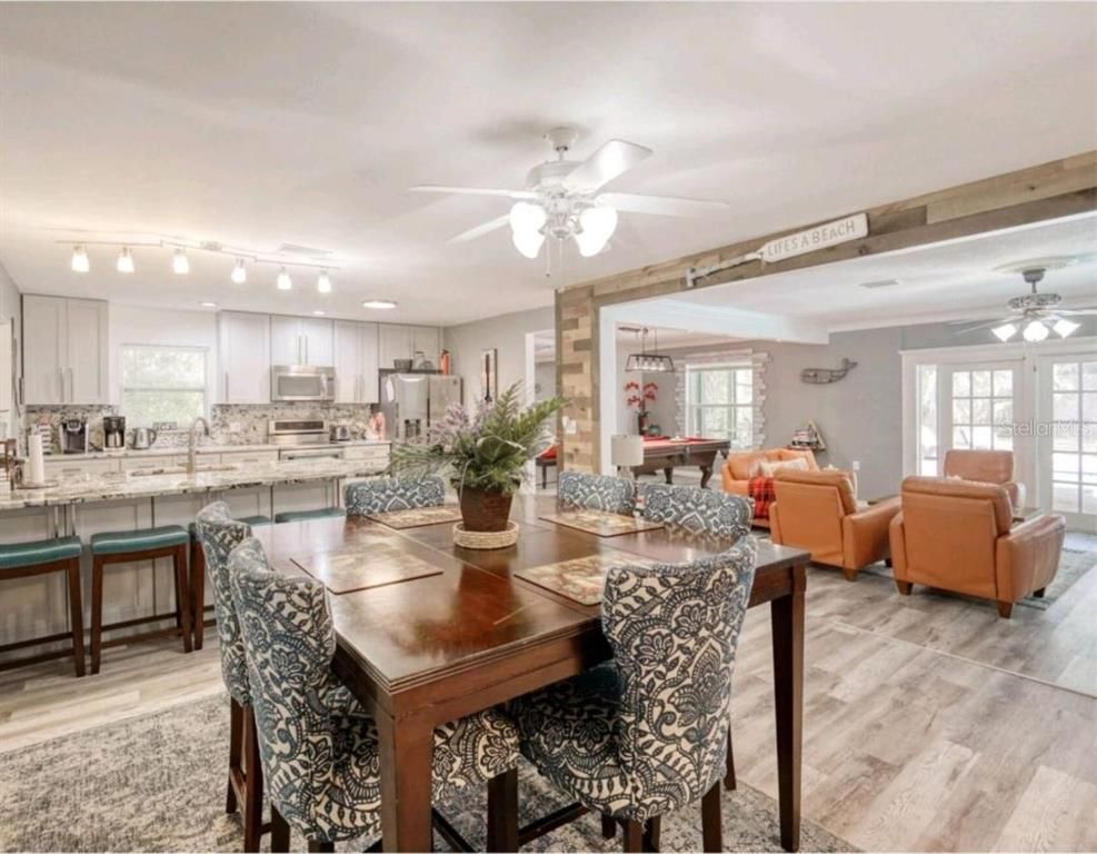 Dining room, Interior, Kitchen, Living room, Pendant Lights, Stainless Steel Appliances, Wood Texture Flooring