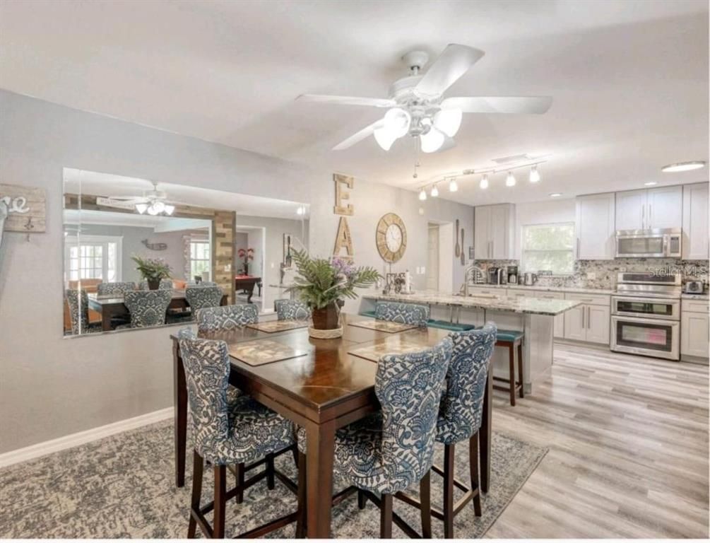 Dining room, Interior, Kitchen, Recessed Lighting, Stainless Steel Appliances, Wood Texture Flooring