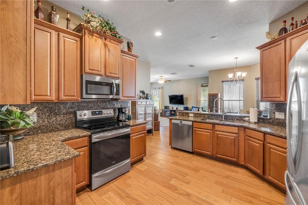 Chandelier, Interior, Kitchen, Recessed Lighting, Stainless Steel Appliances, Wood Texture Flooring