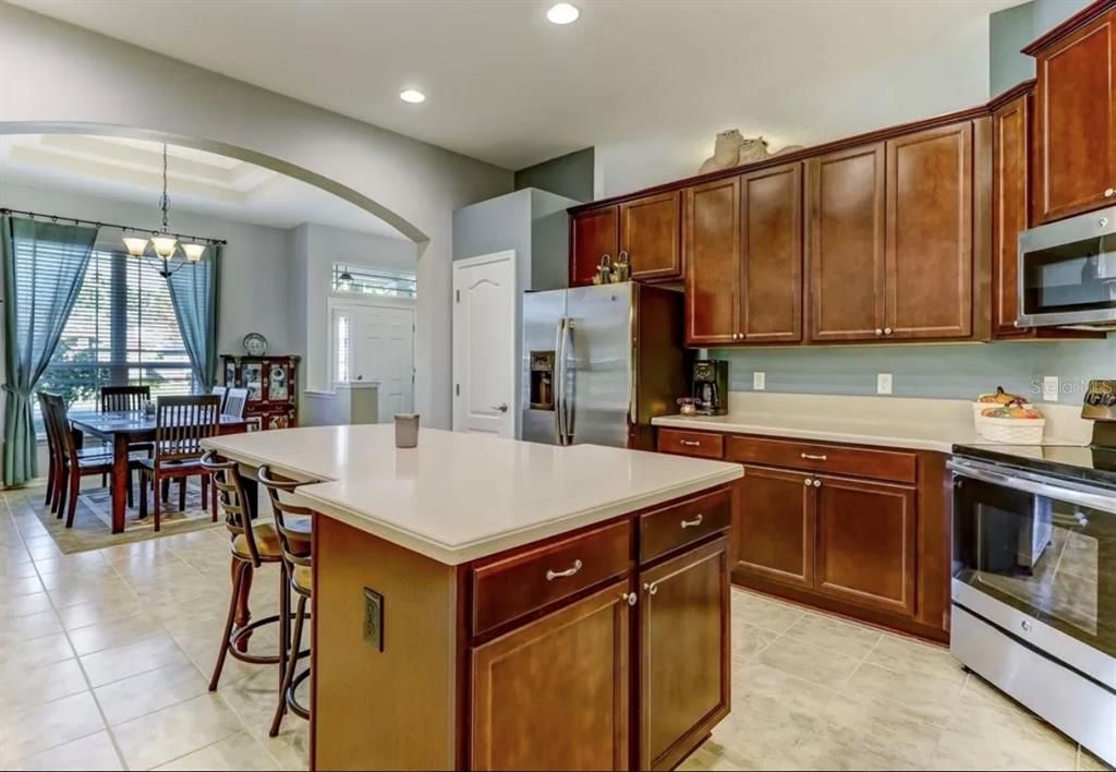 Chandelier, Dining room, Interior, Kitchen, Pendant Lights, Recessed Lighting, Stainless Steel Appliances