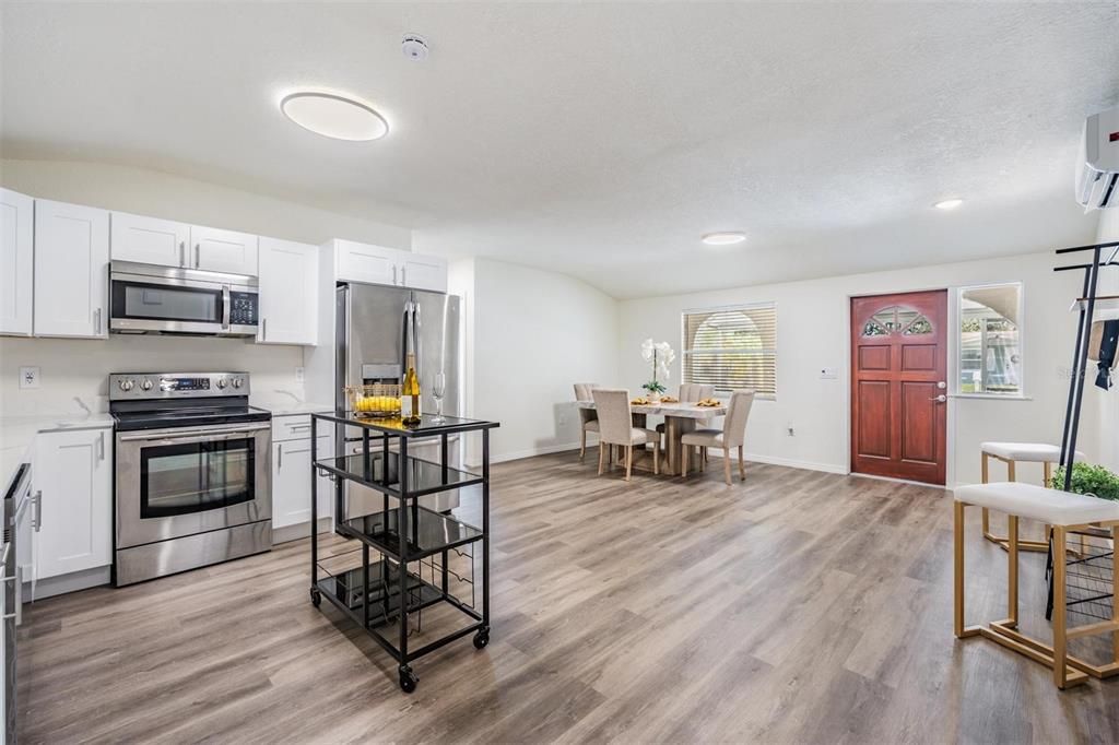 Dining room, Interior, Kitchen, Recessed Lighting, Stainless Steel Appliances, Wood Texture Flooring