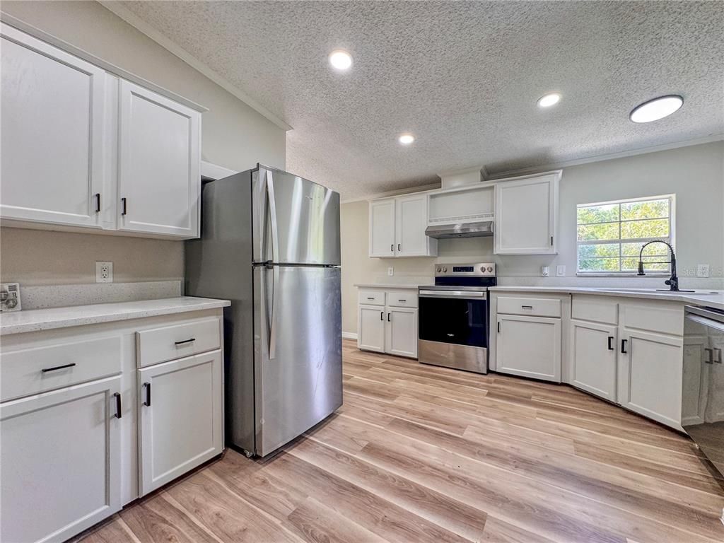 Interior, Kitchen, Recessed Lighting, Stainless Steel Appliances, Wood Texture Flooring