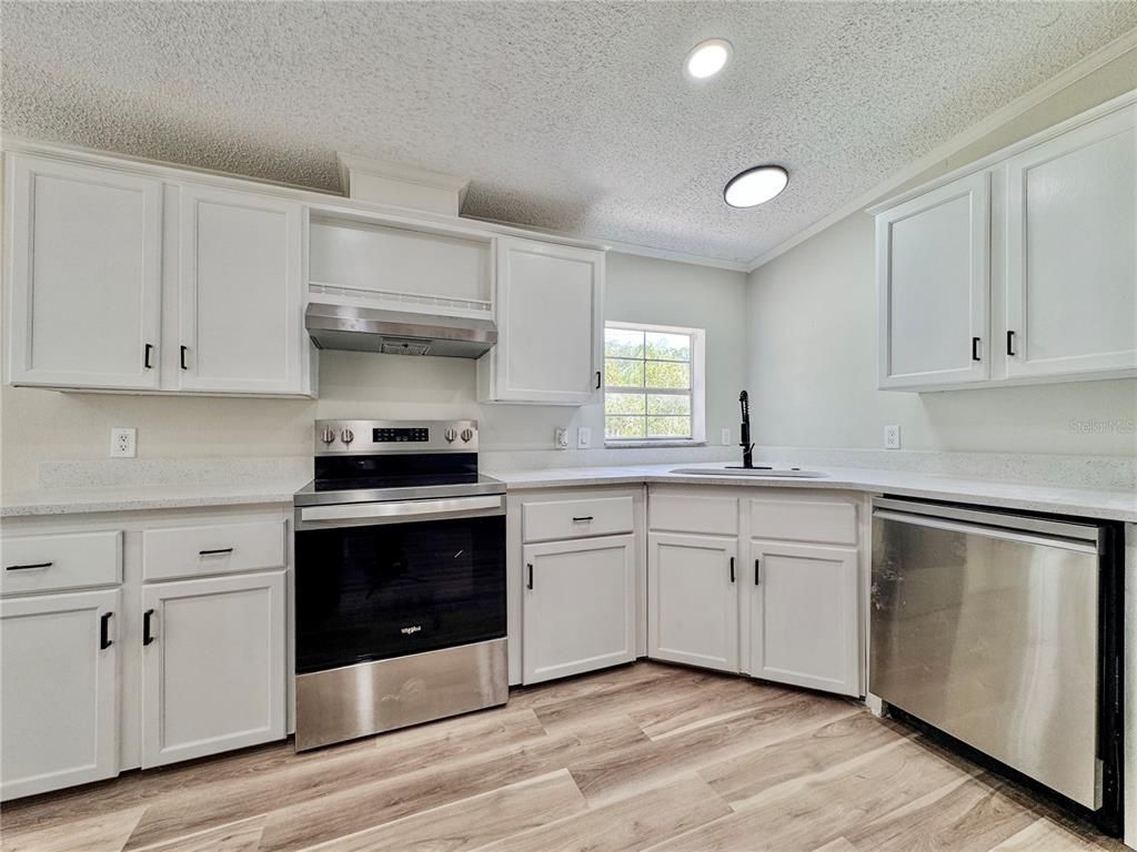 Interior, Kitchen, Recessed Lighting, Stainless Steel Appliances, Wood Texture Flooring