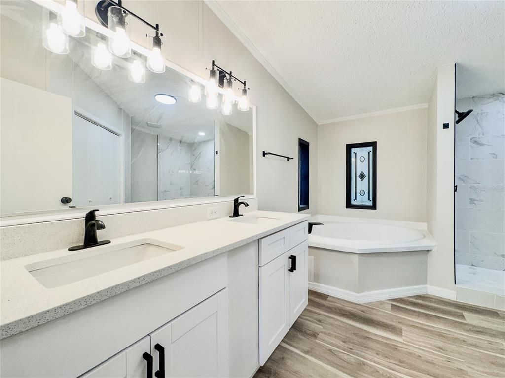 Bathroom, Dual Sink Vanities, Interior, Marble Walls, Wood Texture Flooring