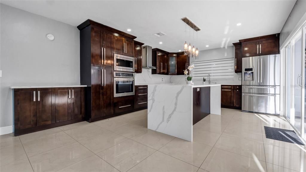 Interior, Kitchen, Marble Walls, Recessed Lighting, Stainless Steel Appliances