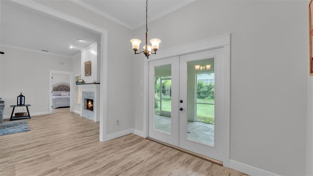 Chandelier, Empty room, Fireplace, Interior, Recessed Lighting, Wood Texture Flooring