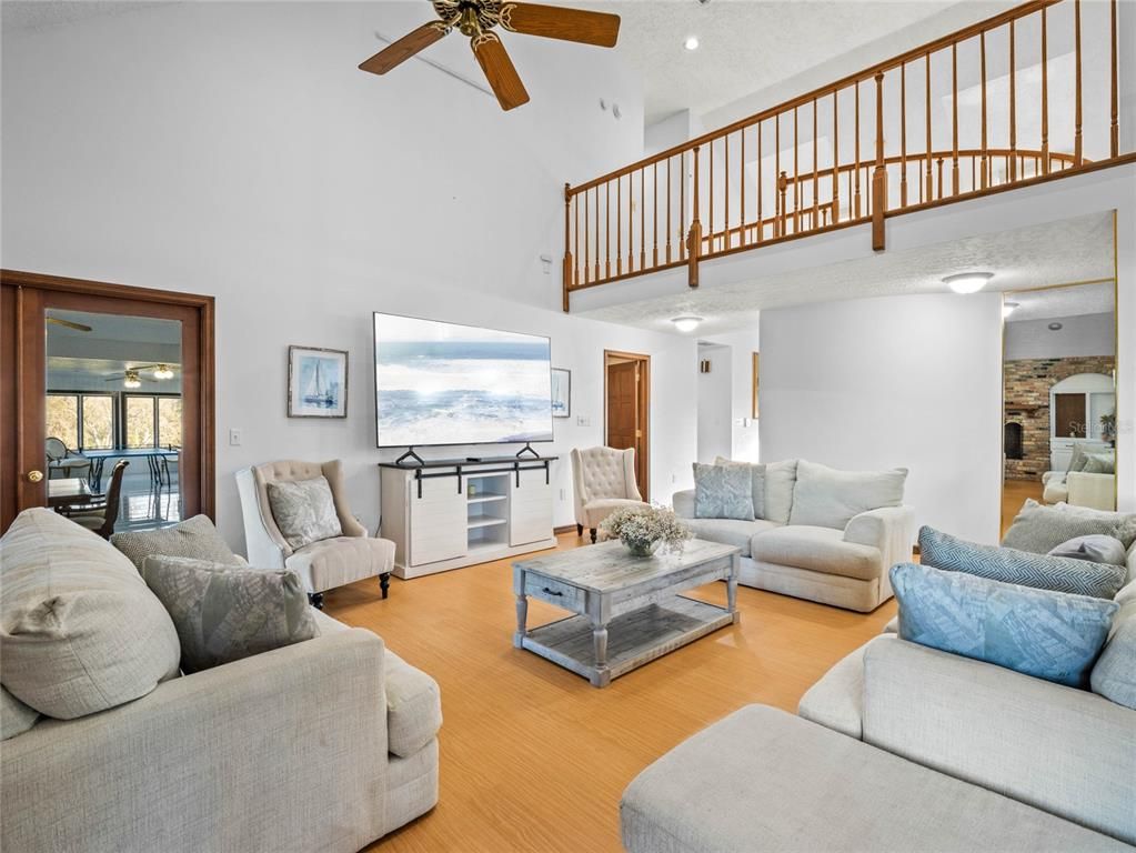 Fitness Equipment, Interior, Living room, Recessed Lighting, Stone Walls, Wood Texture Flooring