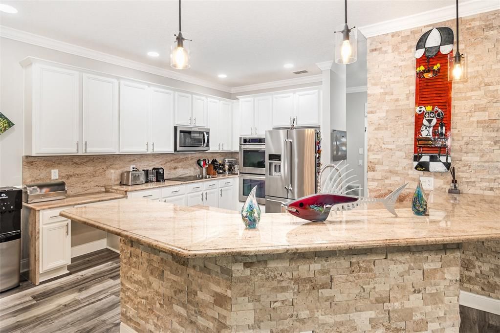Interior, Kitchen, Pendant Lights, Recessed Lighting, Stainless Steel Appliances, Stone Walls, Wood Texture Flooring