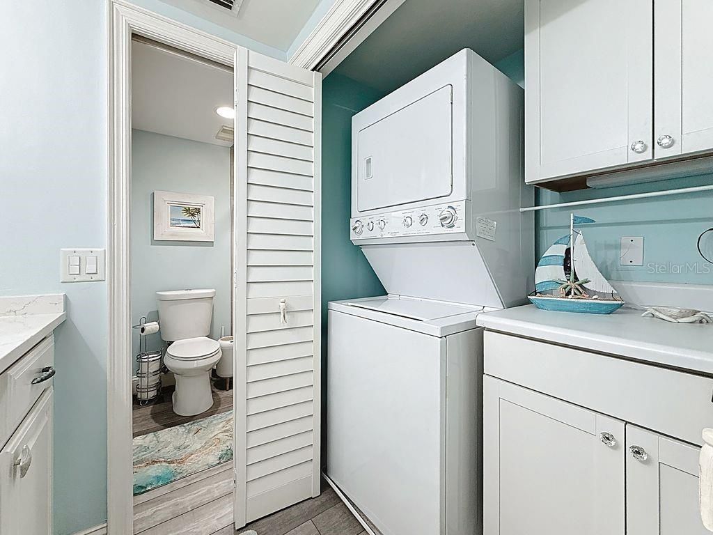 Bathroom, Interior, Recessed Lighting, Utility Closets, Washer, Wood Texture Flooring