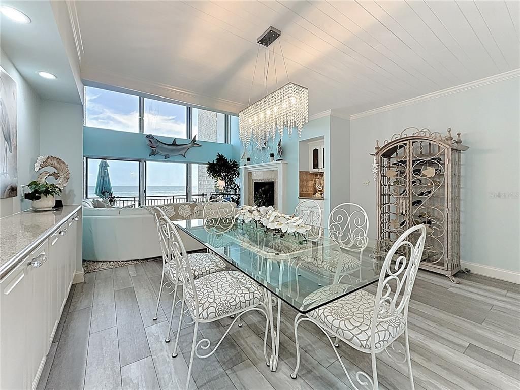 Chandelier, Dining room, Fireplace, Interior, Living room, Recessed Lighting, Water, Wood Texture Flooring