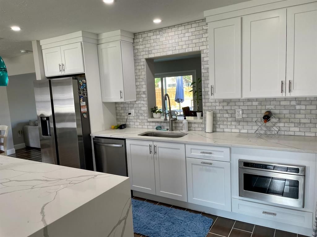 Interior, Kitchen, Recessed Lighting, Stainless Steel Appliances, Stone Walls