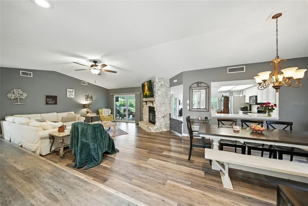 Chandelier, Dining room, Fireplace, Interior, Living room, Recessed Lighting, Wood Texture Flooring