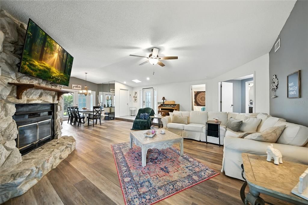 Dining room, Fireplace, Interior, Living room, Pendant Lights, Stone Walls, Wood Texture Flooring