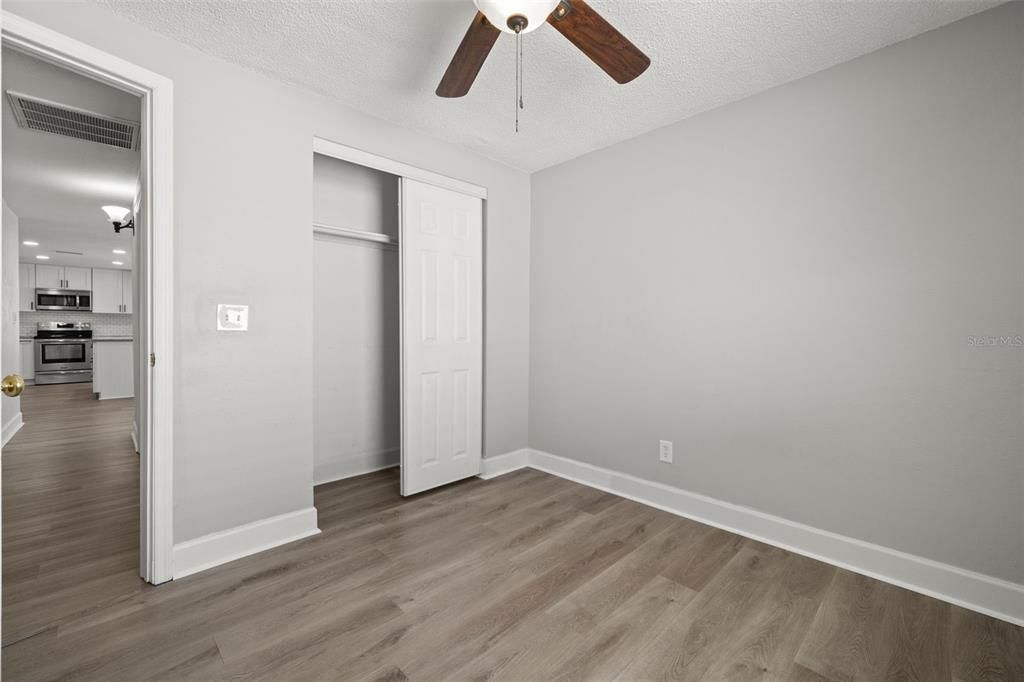 Empty room, Interior, Kitchen, Stainless Steel Appliances, Wood Texture Flooring