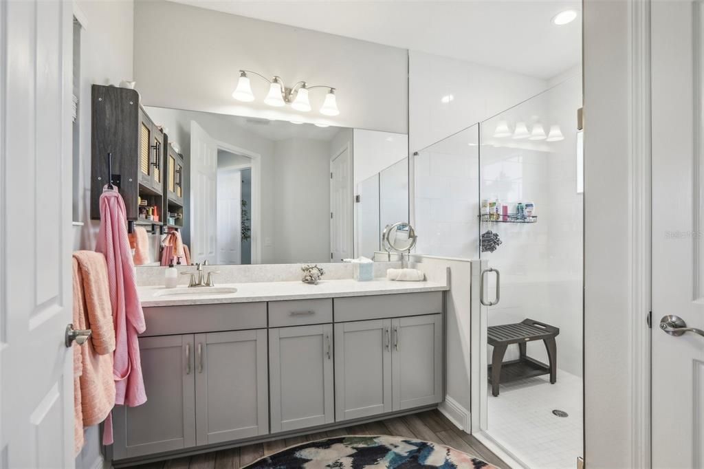 Bathroom, Dual Sink Vanities, Glass Shower, Interior, Recessed Lighting, Wood Texture Flooring