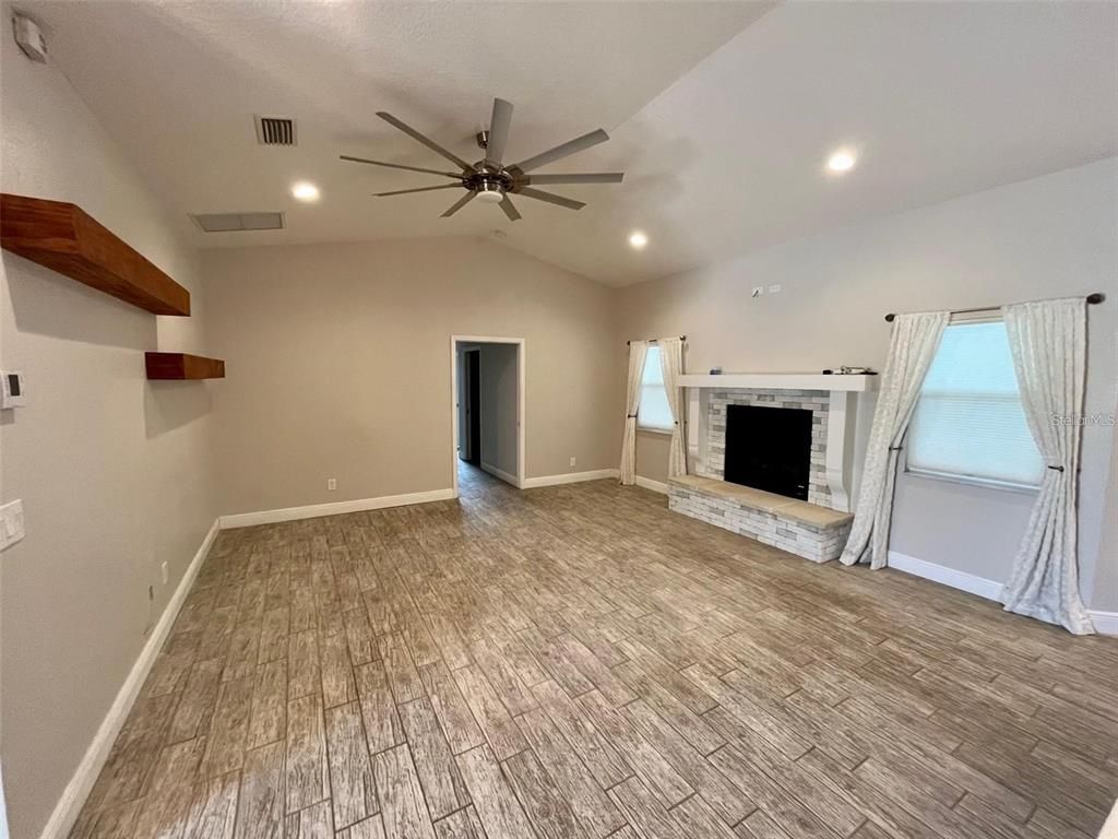 Empty room, Fireplace, Interior, Recessed Lighting, Wood Texture Flooring