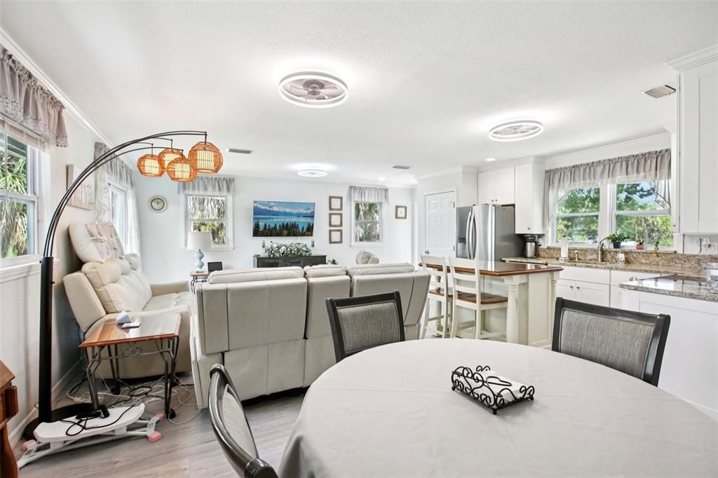 Dining room, Interior, Kitchen, Living room, Recessed Lighting, Stainless Steel Appliances, Wood Texture Flooring