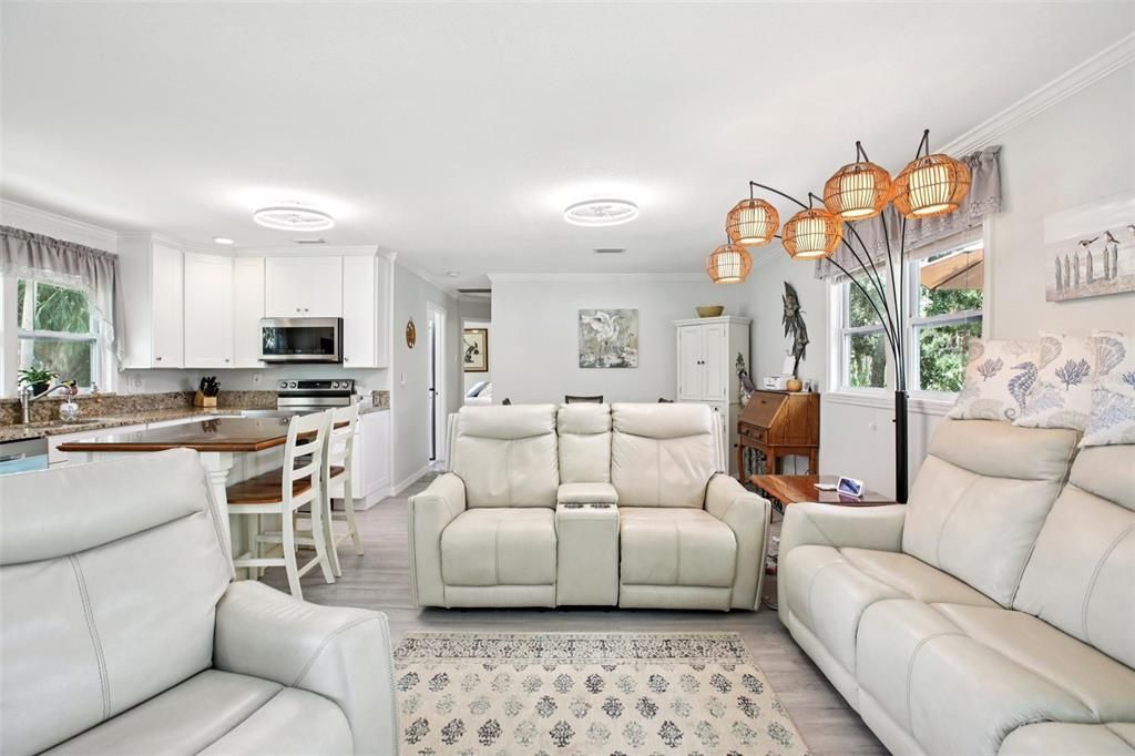 Dining room, Interior, Kitchen, Living room, Recessed Lighting, Stainless Steel Appliances, Wood Texture Flooring
