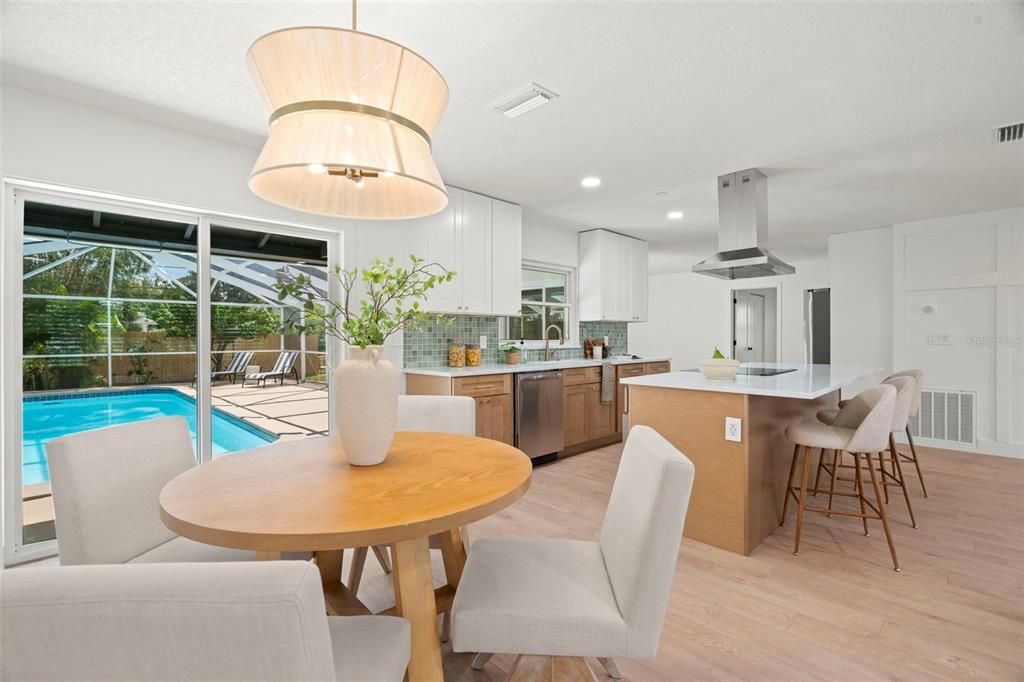 Dining room, Interior, Kitchen, Recessed Lighting, Stainless Steel Appliances, Wood Texture Flooring