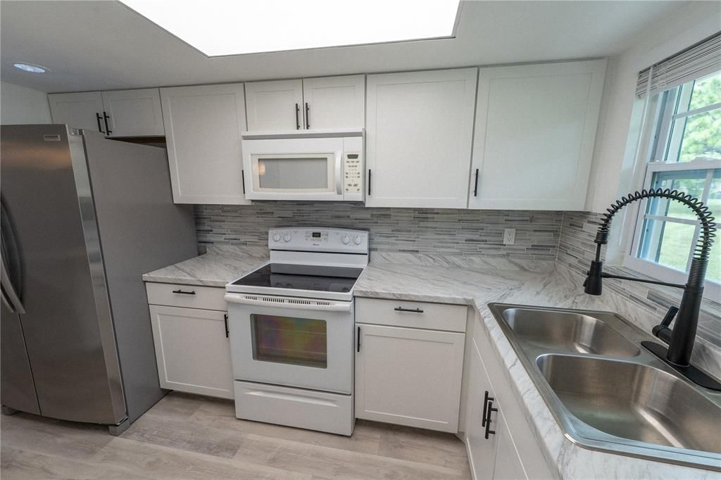 Interior, Kitchen, Marble Walls, Recessed Lighting, Wood Texture Flooring