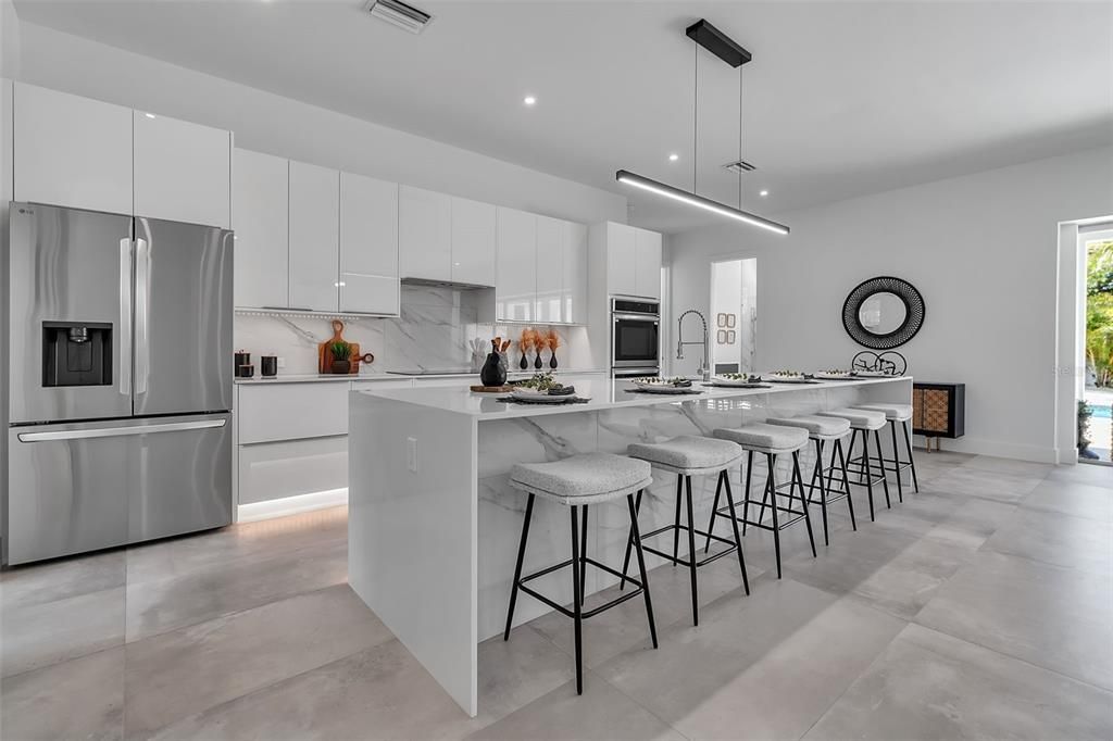 Interior, Kitchen, Marble Walls, Pendant Lights, Recessed Lighting, Stainless Steel Appliances