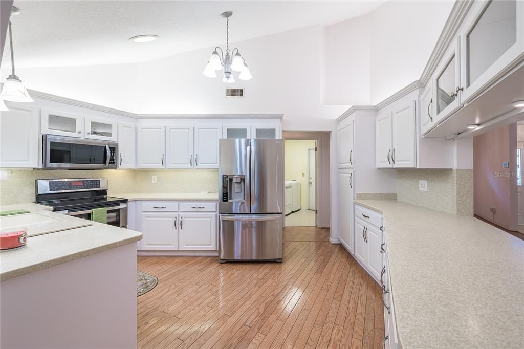 Chandelier, Interior, Kitchen, Pendant Lights, Recessed Lighting, Stainless Steel Appliances, Wood Texture Flooring