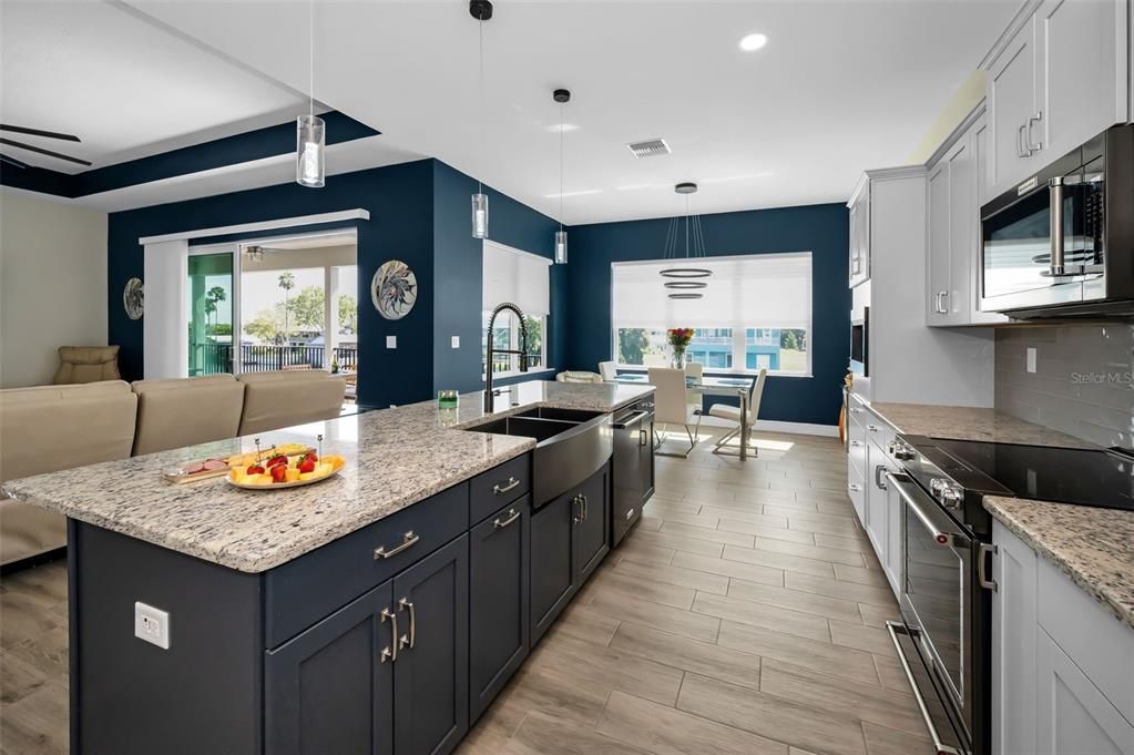 Dining room, Interior, Kitchen, Pendant Lights, Recessed Lighting, Stainless Steel Appliances, Wood Texture Flooring