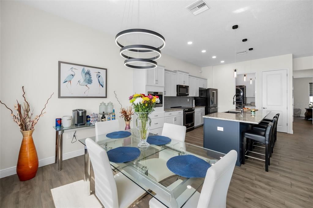 Dining room, Interior, Kitchen, Pendant Lights, Recessed Lighting, Stainless Steel Appliances, Wood Texture Flooring