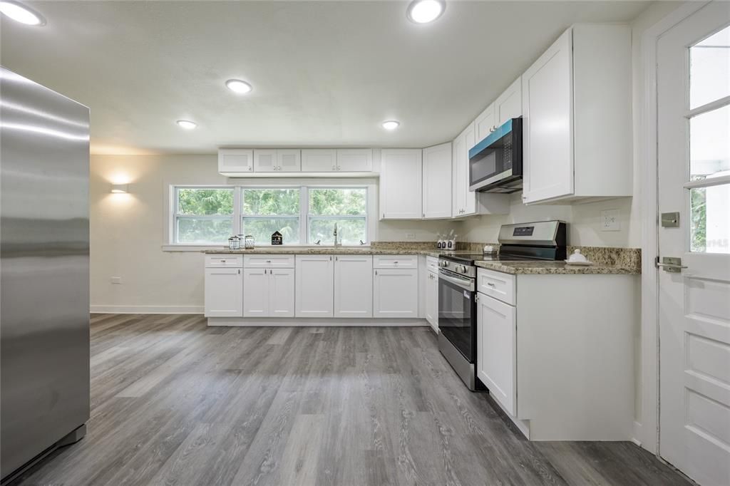 Interior, Kitchen, Recessed Lighting, Stainless Steel Appliances, Wood Texture Flooring