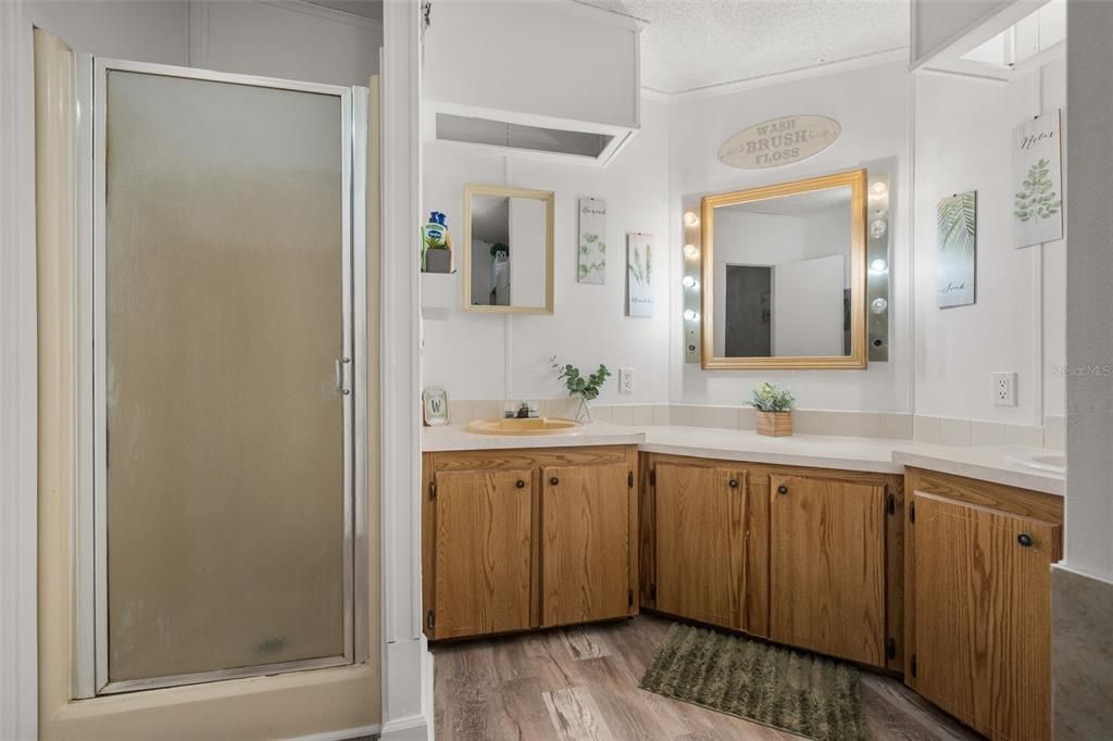 Bathroom, Dual Sink Vanities, Glass Shower, Interior, Wood Texture Flooring