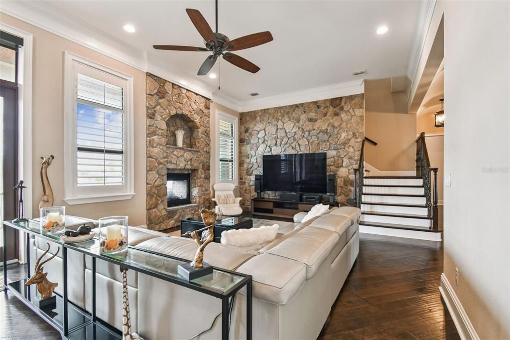 Fireplace, Interior, Living room, Recessed Lighting, Stone Walls, Wood Texture Flooring