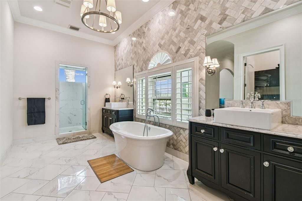 Bathroom, Chandelier, Dual Sink Vanities, Free Standing Baths, Glass Shower, Interior, Marble, Marble Walls, Pendant Lights, Recessed Lighting
