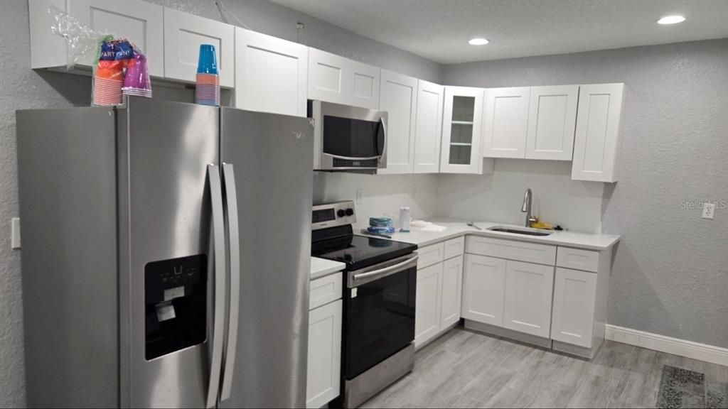 Interior, Kitchen, Recessed Lighting, Stainless Steel Appliances, Wood Texture Flooring